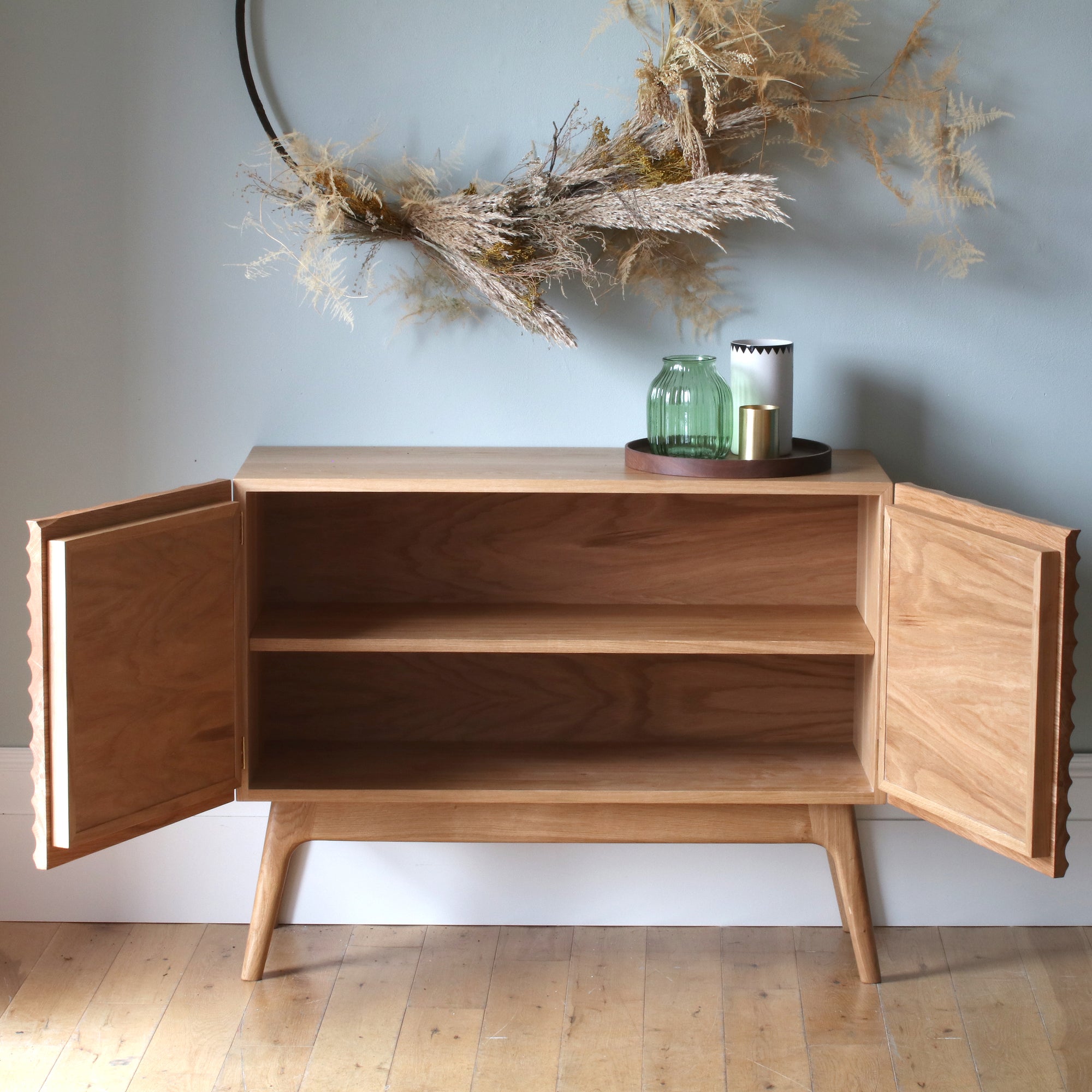 Sideboard with sculpted doors